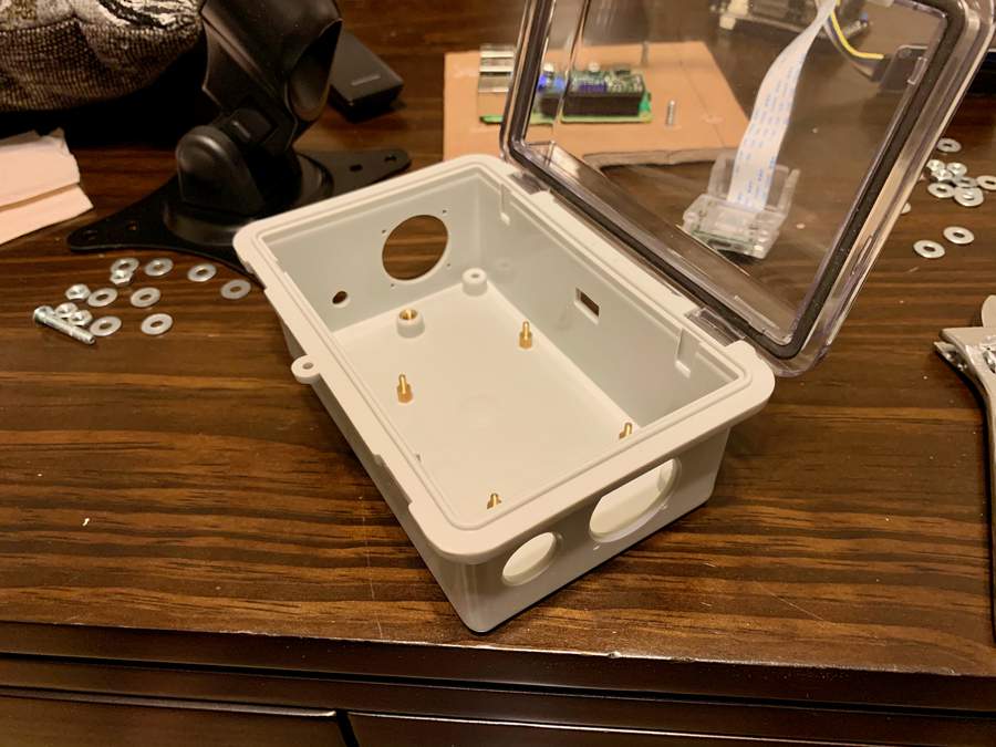 Case with holes drilled, top open, power cable hole cut.