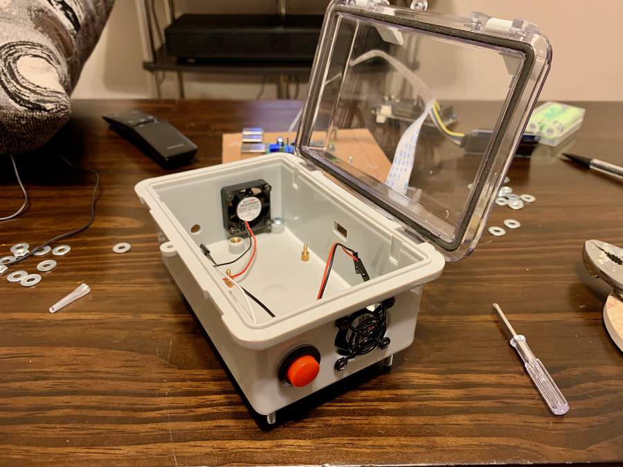 Case with fans and button installed.