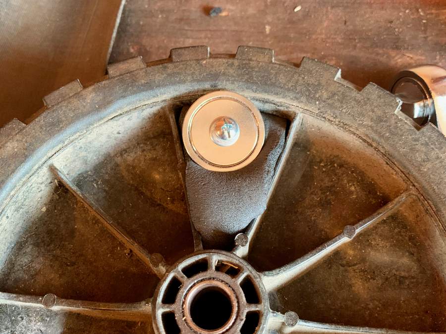 Magnet mounted onto wheel with foam to secure it.