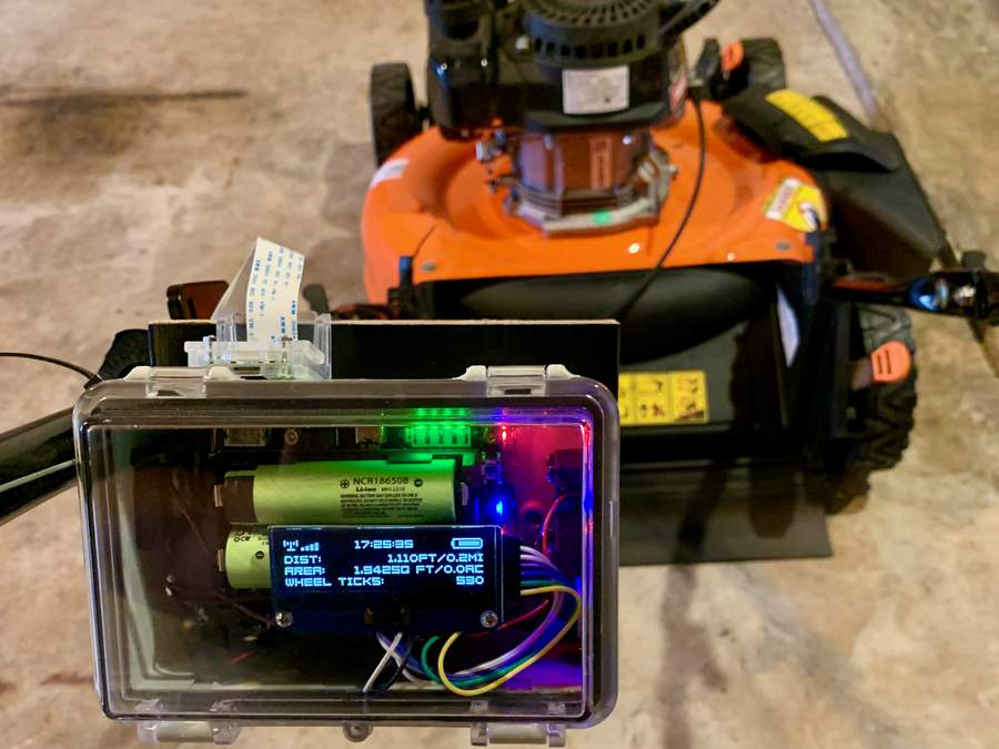 Top view of Pi in case mounted to lawnmower arm.