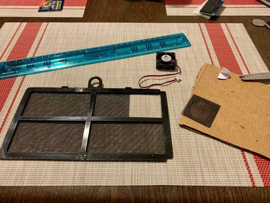 Computer air filter with section cut out.